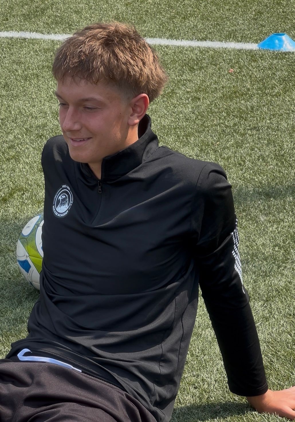 Proline player wearing the black long-sleeve uniform shirt